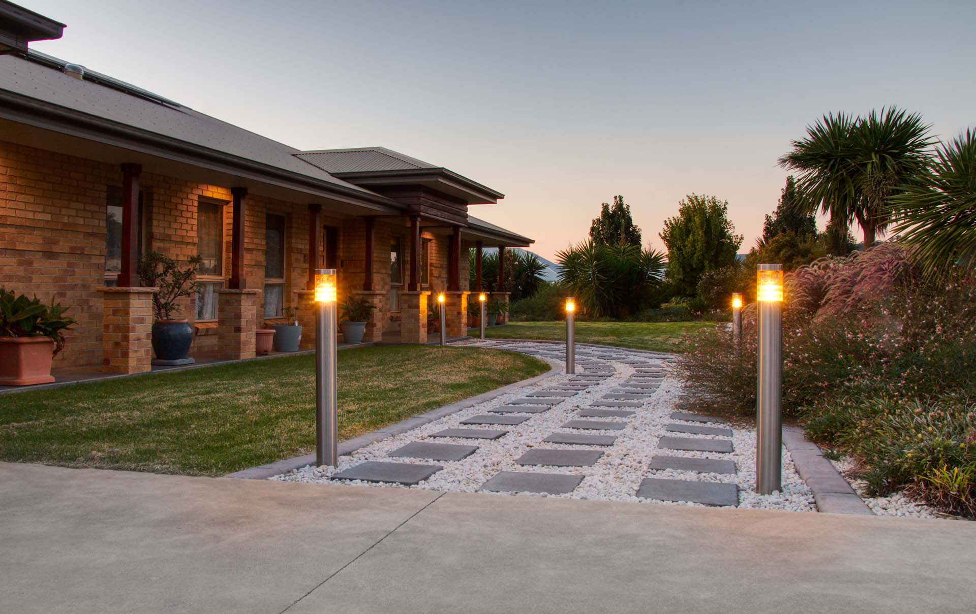 Paving in gray pebbles and bollard lights in North Tamworth NSW